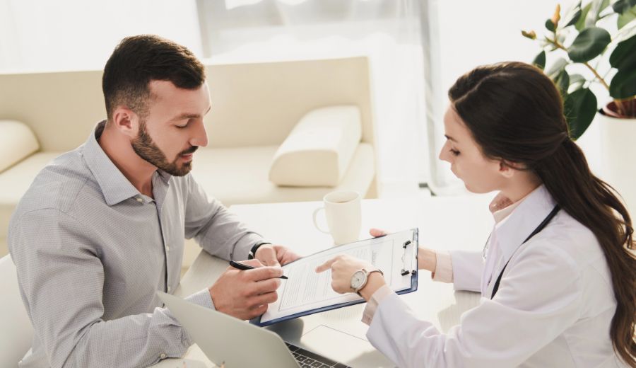 Agent and client in Joliet, IL reviewing a life insurance policy